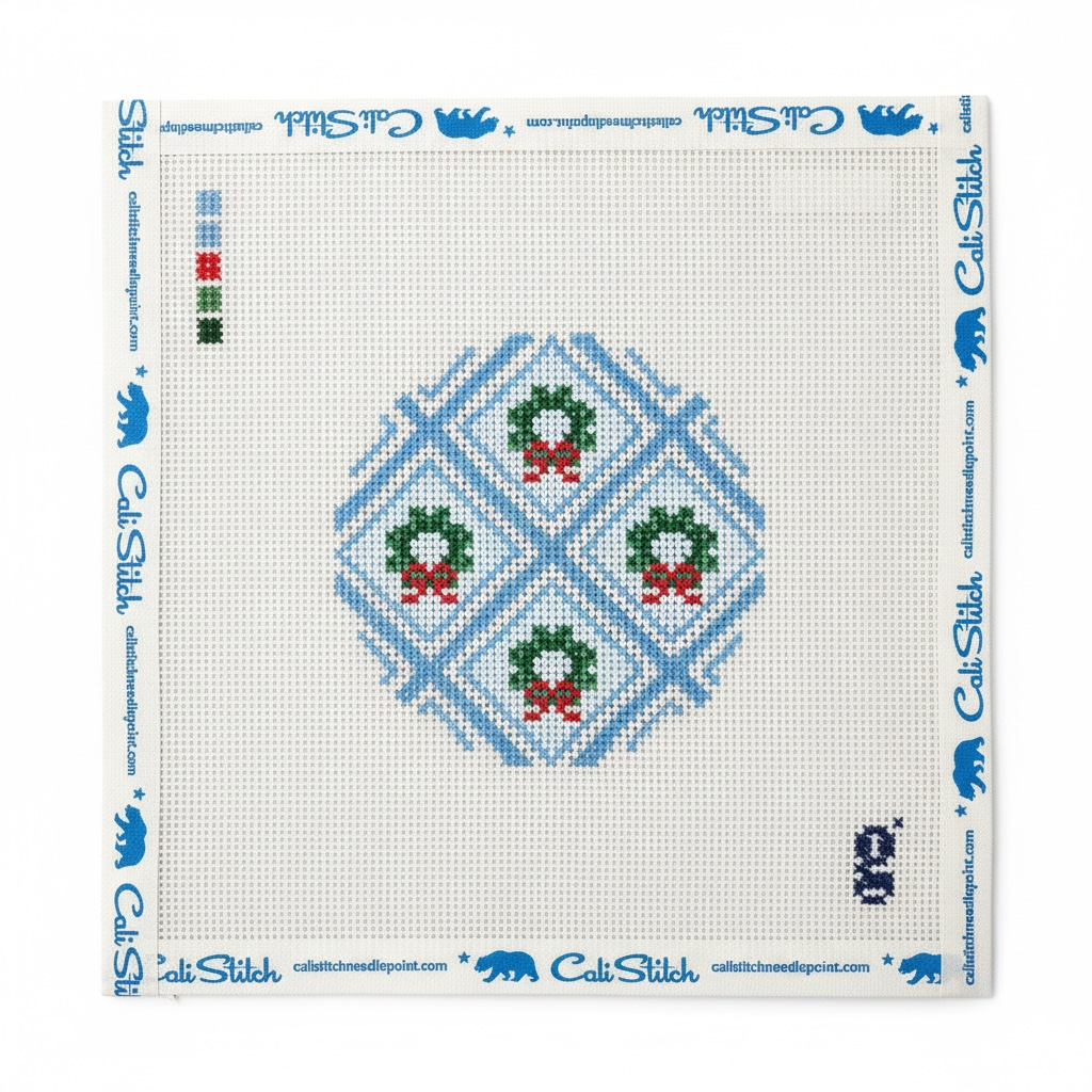 Canvas with Christmas wreaths on a blue and white background